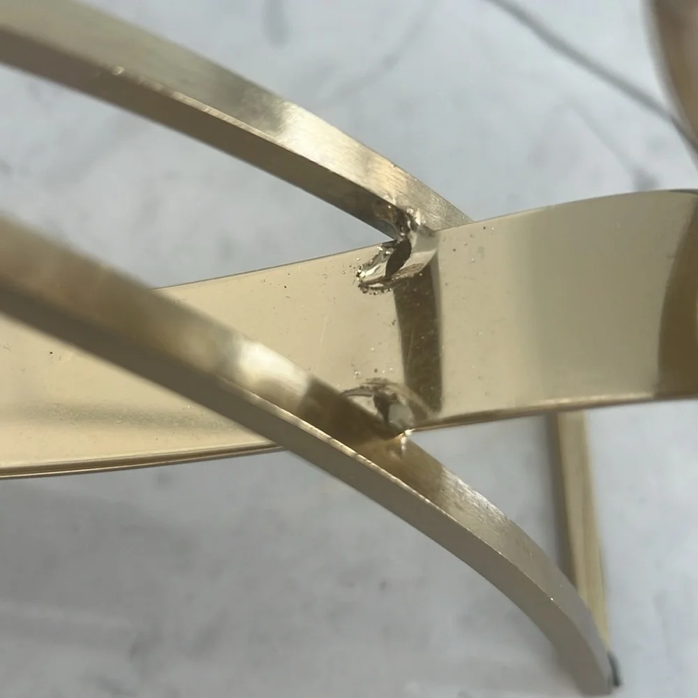 Elegant gold metal like candle holder with beautiful shiny crystal like gems